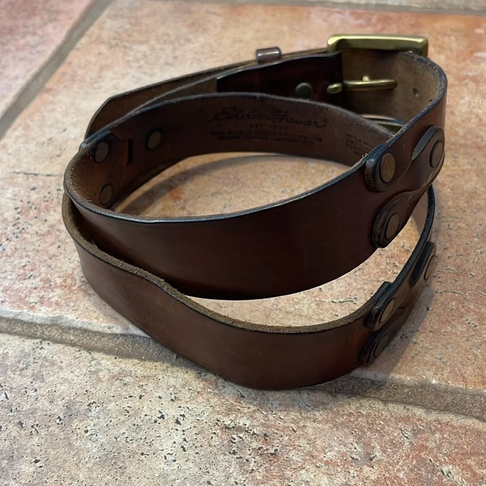 Very vintage Eddie Bauer, leather and grommet belt with brass buckle size 36